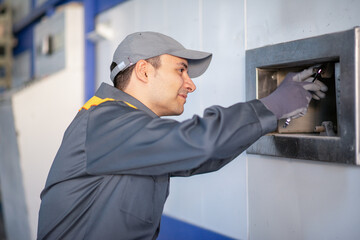 Worker fixing an industrial machinery