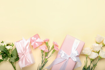 Composition with gift boxes and beautiful flowers on color background