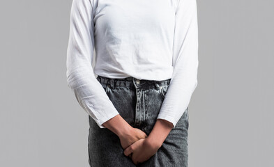 Sick woman hands holding pressing her crotch lower abdomen. Medical or gynecological problems,...
