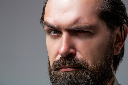 Solid man with beard and mustache. Closeup portrait of athletic bearded man. Handsome stylish bearded man. Sexy male, macho, long beard. Attractive caucasian bearded hipster
