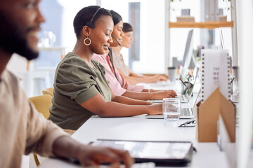 Were always happy to help. Shot of a businesswoman wearing a headset while working in a call centre.