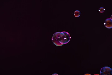 Rainbow bubbles on dark background