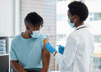 That hurts doctor. Shot of a doctor giving her patient an injection.