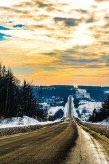 Landscape with the image of winter road at sunset in Tarusa, Russia