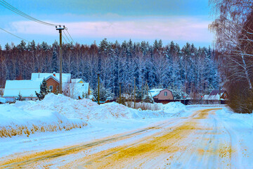 Landscape with the image of winter road between the big snowdrift