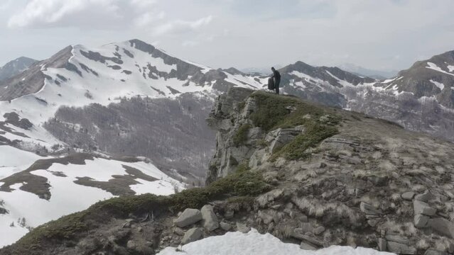 Hiker taking a break after reaching mountain top