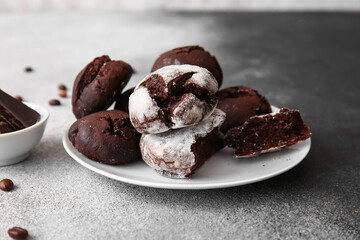 Plate of chocolate brownie cookies on grunge background