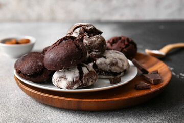 Plates of chocolate brownie cookies on table