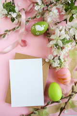 easter greeting card. colorful Easter eggs, willow twigs and spring flowers 