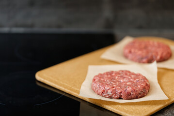 hamburger meat grilling for burgers. Homemade cutlets in frying pan. close up