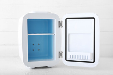Small cosmetic refrigerator on light table
