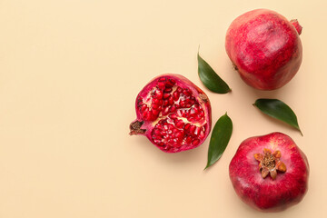 Delicious pomegranates on yellow background
