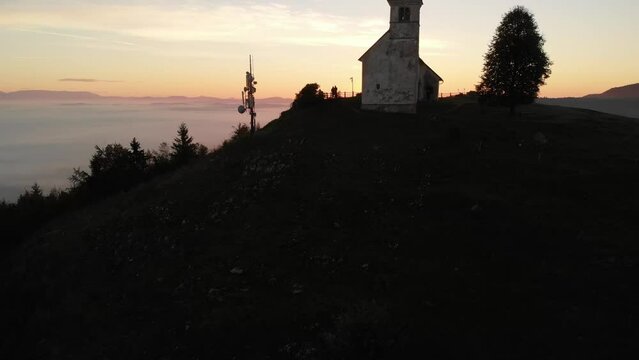 Beautiful sunrise shoot Drone shoot,moody green, green woods, clouds, sunrise , sunny day, woods, afternoon Europa SLOVENIJA, Ljubljana, prodia, from back, church religion doun to up vol.2
