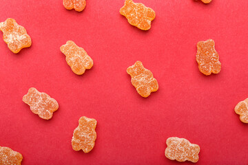 Tasty jelly bears on color background
