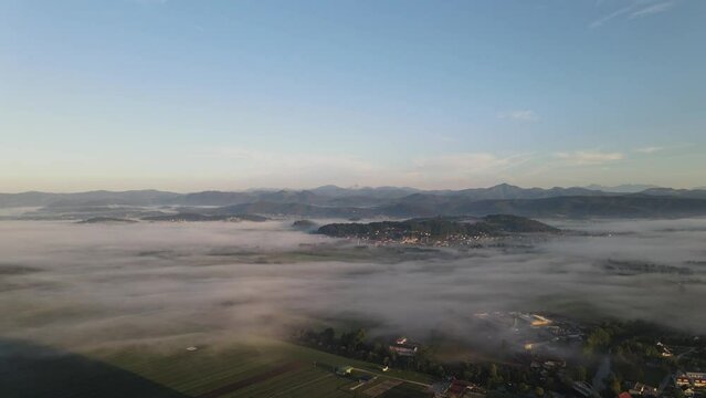 Drone shoot,moody green, green woods, clouds, sunrise , sunny day, woods, afternoon Europa SLOVENIJA, Ljubljana , NANOS, prodia, from back, church religion