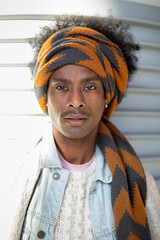 Portrait of young African American man with afro hairstyle and turban. Men's fashion and lifestyle...