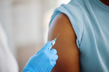 This vaccine will change my life. Shot of a doctor about to inject the arm of a patient.