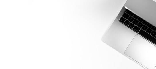 Modern laptop flat lay silver background. Notebook keyboard. Office workplace table, minimal design concept. Top view, copy space photo