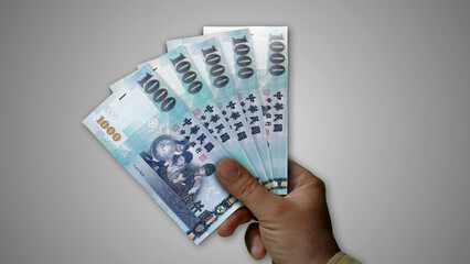 Taiwan Dollar growing pile of money in hand concept 3d illustration