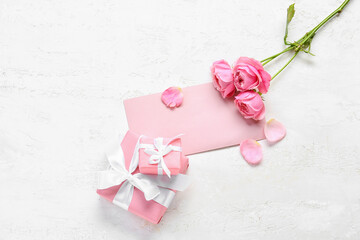 Blank greeting card for International Women's Day, gift boxes and roses on light background