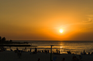 Montevideo, Uruguay - 11th January 2022 - Beautiful sunset on Ramires beach with bathers on a summer day in Montevideo Uruguay.