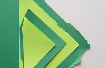 green paper forms on a light background