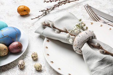 Stylish Easter table setting on light background