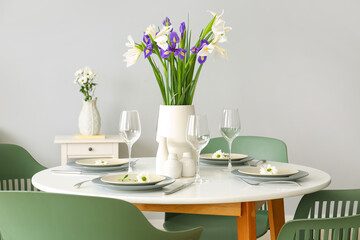 Dining room with table served for International Women's Day celebration