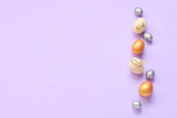 Composition with Easter eggs on purple background