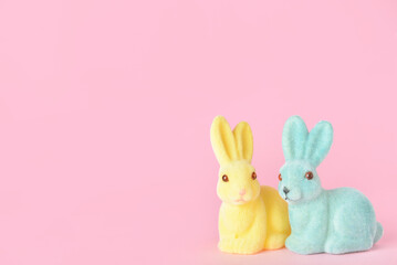 Cute Easter bunnies on pink background