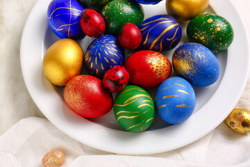 Plate with stylish Easter eggs  on light background
