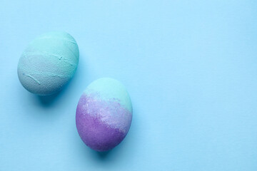 Beautiful Easter eggs on blue background