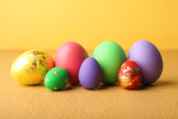 Beautiful Easter eggs on beige background