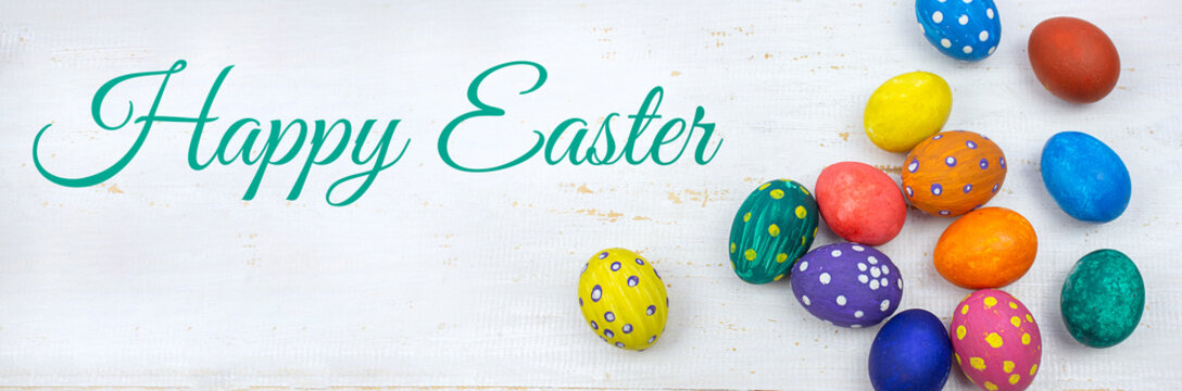 Easter background. Easter eggs. Happy Easter card. Multi-colored Easter eggs. Easter. Easter eggs on a white wooden background. Banner. copy space