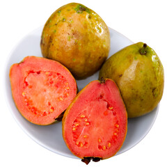 Closeup of whole and halved tropical apple guavas. Isolated over white background
