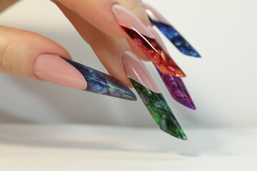 Long artificial  french manicured nails. Extension nails. Nails art french manicure.