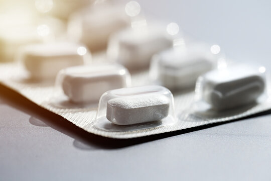 Closeup Of Pills In Blister Pack. Headache Pills, Painkillers, Antibiotics Or Antidepressants Tablets