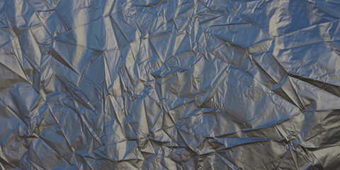 Full frame close-up view of a large wrinkled silver gray metallic tarp - obrazy, fototapety, plakaty