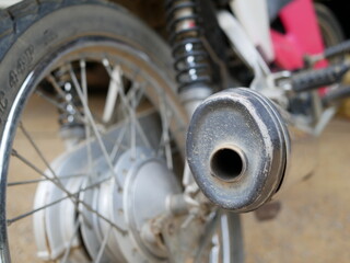 closeup of motorcycle exhaust system.