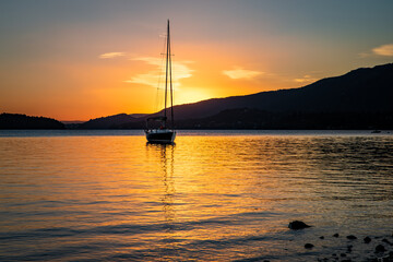 beautiful sunrise on lake nahuel huapi with boats