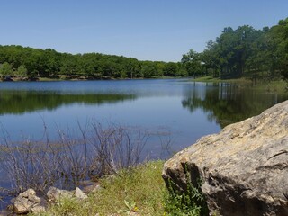 Scenic lakeview with a big rock on the shoreline