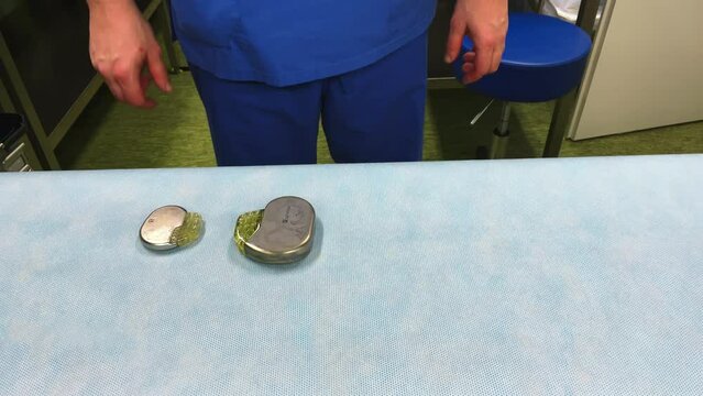 a pacemaker and an implantable defibrillator are placed side by side
