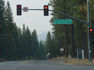 Traffic lights with directions to Black Bart Avenue and Cold Creek Trail, Highway 50, California