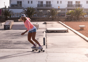 Caucasian woman skating in the skate park