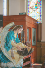 Angel catholic religious statue inside the church