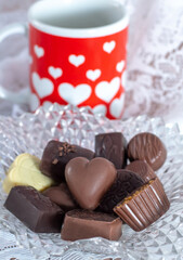 Fancy Candy dish of chocolate with a heart mug is a lovely still life for Valentines day