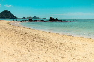 The sloping Kute Beach in Lombok, with its calm waters, is the main attraction of Lombok island tourism, West Nusa Tenggara, Indonesia.