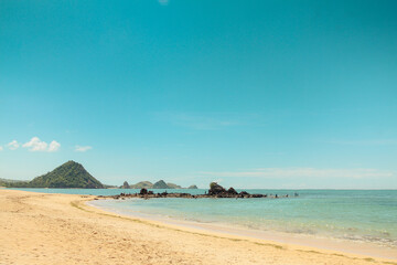 The sloping Kute Beach in Lombok, with its calm waters, is the main attraction of Lombok island tourism, West Nusa Tenggara, Indonesia.