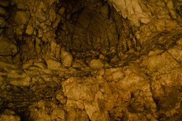 The natural stone texture of an old dark cave
