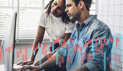 Success business couple relaxing using digital desktop computer looking at screen progress of business financial investment money data graph and chart business growth increase at home